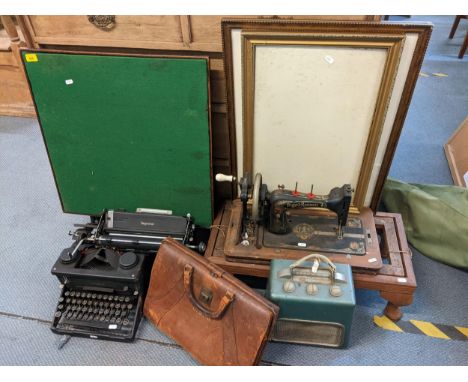 A mixed lot to include a typewriter, sewing machine, accountants bag, card table, engraving, frame and radioLocation: 