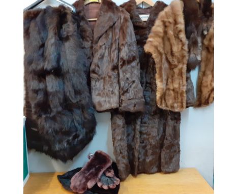 A vintage brown Ermine three quarter length coat, a vintage chestnut brown ermine jacket, a large modern black faux fur wrap,