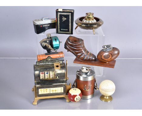 A collection of Sporting and Gambling Novelty desk lighters, including a Monte Carlo Roulette wheel, an Antique Slot-a-Lighte