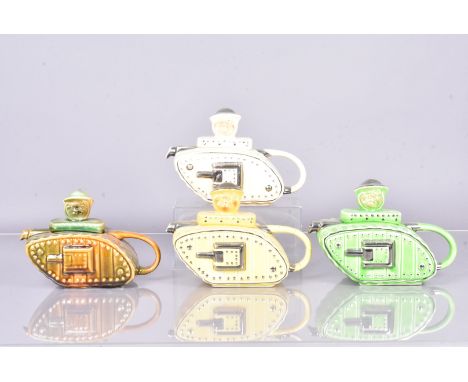 Four early 20th Century pottery Churchill Tank teapots, possibly Sadler, in four different colour variations, Yellow, Cream, 