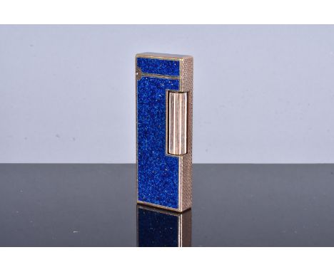 A Dunhill Rollagas Gemline pocket lighter, the yellow metal and lacquered pocket lighter with blue speckled panels and engine