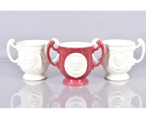 Burleigh Ware, three twin handled loving cups depicting Churchill and Roosevelt, 'Champion of Democracy', one in a reddish gl