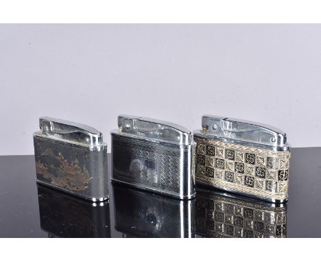 Three Prince Muselite musical lighters, each with different decoration, an oriental example, one with engine turned designs a