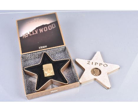 Hollywood's Leading Light, a 2001 brass Zippo lighter with applied Hollywood Star design, in retailer's fitted Star Case and 