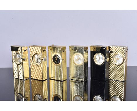 Six yellow metal watch lighters, to include Foska, Ilona, Drimex, Bucherer, and another, mainly with engine turned design (pa