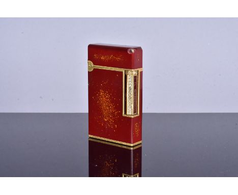 A Dupont gold plated and red lacquered pocket lighter, serial 17JPR29, Laque de Chine, Stylo Plume L2 (Poudre D'or Monte), wi