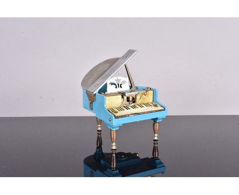 A Prince Piano Model II desk lighter, in the form of a Grand Piano, in blue and chrome, no postal shipment for this lot 