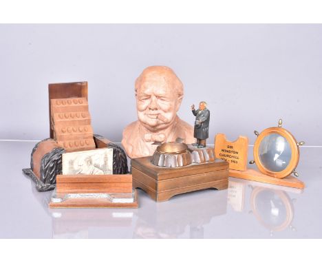 A carved wooden Winston Churchill ashtray music box, with Swiss Reuge movement, together with a 1940s desk top cigarette hold