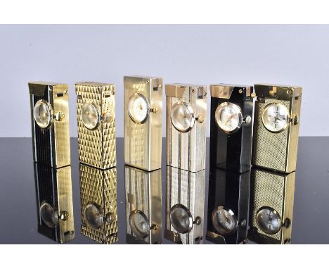 Six yellow base metal watch lighters, comprising Fero, Foska, Espit, Rivo, and others, mainly engine turned design (parcel), 