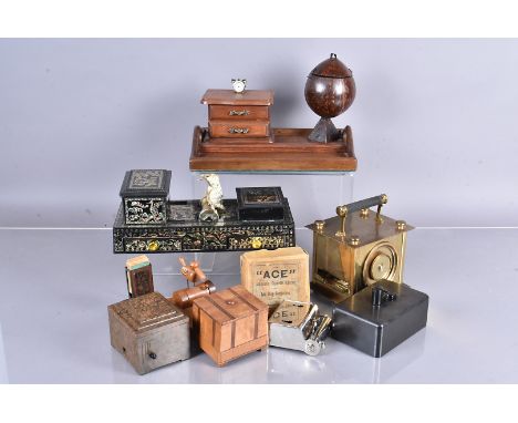 A selection of cigarette dispensers and table lighter, including a Magic Casket, an 'ACE' Automatic Cigarette Ejector and Ash