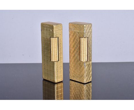 Two Dunhill gold plated lighters, both with US.RE 24163 Patent numbers, engine turned designs (2), no postal shipment for thi