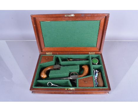 A pair of 19th Century Welch Percussion Cap pistols, one with 11.5mm calibre, the other 11.9mm calibre, both with etched desi