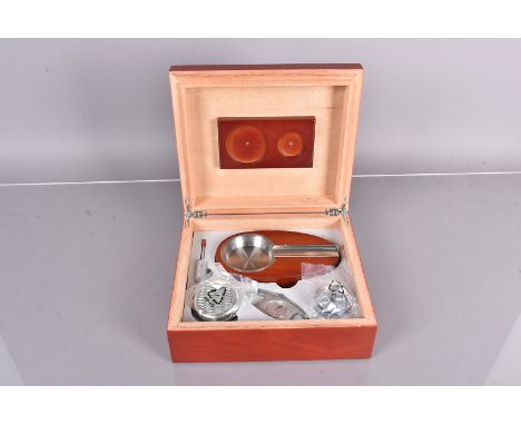 An unused Sikarlan Humidor with accessories, including ashtray and cigar cutter (parcel) 