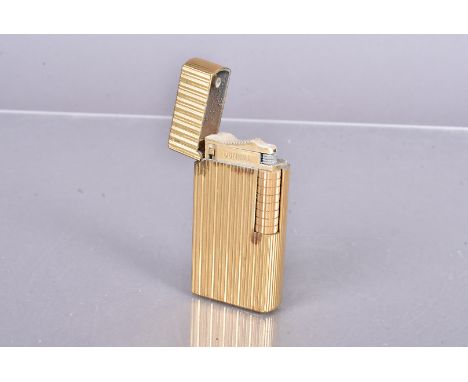A Dunhill gold plated lighter, Patent 922 BJ, with engine turned design, no postal shipment for this lot 