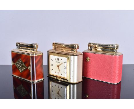 A Colibri Clock desk lighter, with 8 day movement, together with two other Colibri Monopol desk lighters, one with leatherett