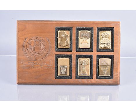 An American Classic Zippo Lighter Display, comprising six Zippo lighters, four by Barrett Smythe, including Ring, Tea, Carpe 