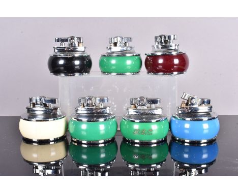 Seven Rolstar Art Deco lighters, with coloured bands, including three green, a blue, cream, burgundy and black (7), no postal