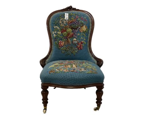 Victorian mahogany framed nursing chair, applied rose carved cresting rail, back and sprung seat upholstered in floral tapest