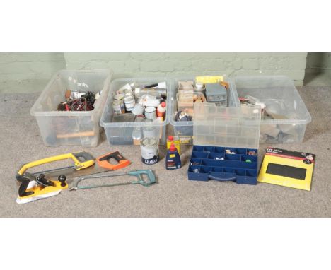 Four boxes of assorted tools, paints and adhesives to include drill bit set, fiberglass tissue repair, hand tools, spray pain