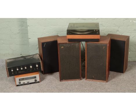 A Beogram record player with two pairs of speakers including Wharfedale and Sharp examples together with a Sansui AU-101 ster