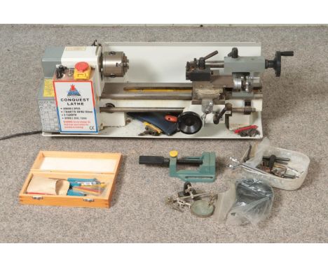 A Conquest Lathe by Chester UK with variable speed and 7" diameter swing. Also includes small quantity of accessories includi