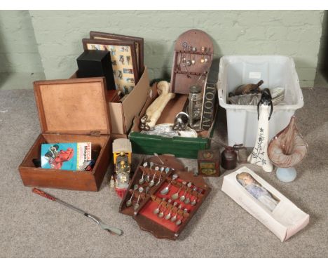 Three boxes of miscellaneous to include composite figures, art glass vase, commemorative spoons, cigarette cards, watch displ
