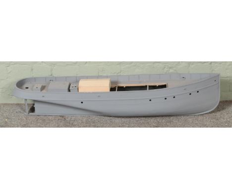 A composite model boat hull with upper deck and partially built balsa wood cabin. Approx. boat length 103cm.  