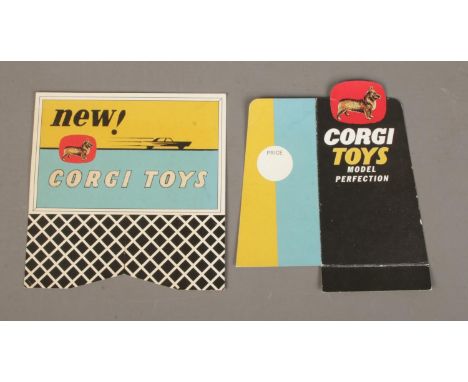 Two cardboard Corgi Toys promotional advertising signs; 'Model Perfection' and 'New! Corgi Toys'.  
