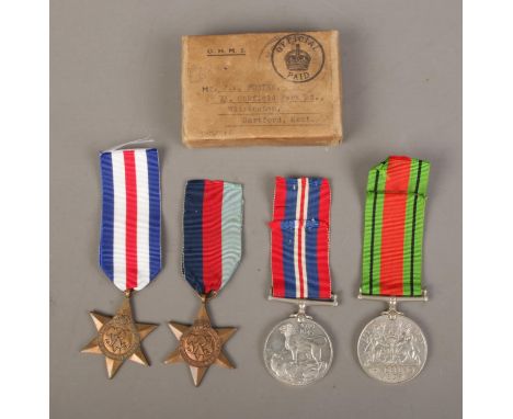 A set of four WWII medals with ribbons in original box, awarded to J.M Foster, Royal Army Service Corps. Includes France and 
