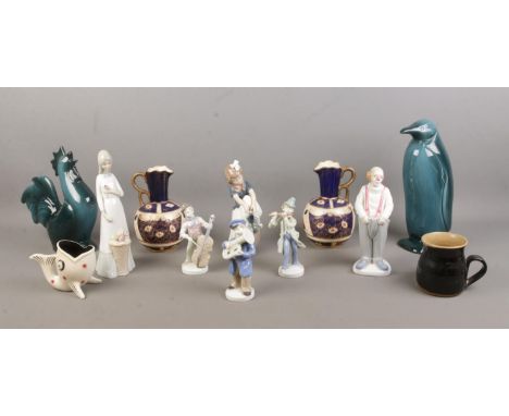 A collection of assorted ceramics, to include NAO by Lladro and Lladro style figures and a pair of KFM jugs.  