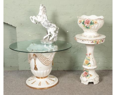 A collection of large ceramics including large glass top ceramic table, jardinière stand and large horse  