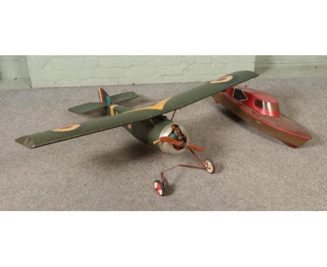 Two remote control kit models to include RAF propellor plane and model speed boat.  