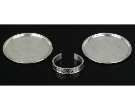 Georg Jensen &amp; Wendel; Two silver coasters in the 'Lily of the Valley' design, stamped 'Sterling, Denmark' to the undersi