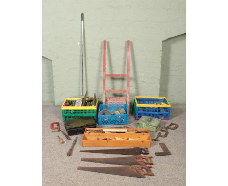 A large collection of assorted tools, to include sack barrow, G clamps, saws, tool handles, try square and screws.  