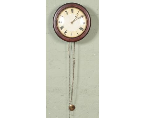 A mahogany postman's alarm clock with roman numeral dial with pendulum.  Does not include weights