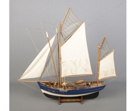 A display model of a Thonier: French Tuna fishing boat featuring cloth sails, rigging and stand with name plaque. Approx. dim