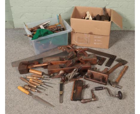 A large quantity of woodworking tools including planes, chisels, screw drivers, wood turning tools, saws, rasps etc  