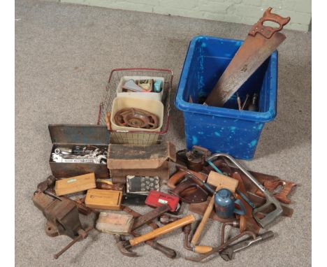 A box and a basket of tools. Includes vice, spanners, Primus stove, hand saws etc.  