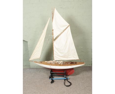 A very large remote control model pond yacht titled Moonbeam on display stand modelled after an early 1910's example. Approx.