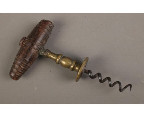 A Henshall type 19th century corkscrew with brass shank design with wood turned handle.  