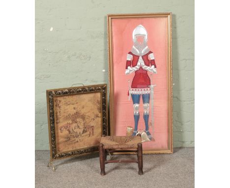 A large framed needlework on silk formed as a knight (possibly as Sir John Oldcastle) together with a framed tapestry firescr
