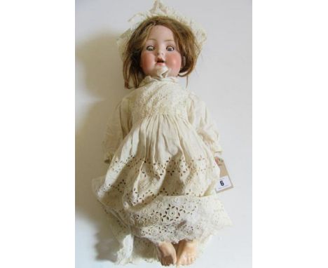 A Bahr & Proschild bisque head character doll with blue glass sleeping eyes, open mouth and teeth, dark blonde wig, compositi
