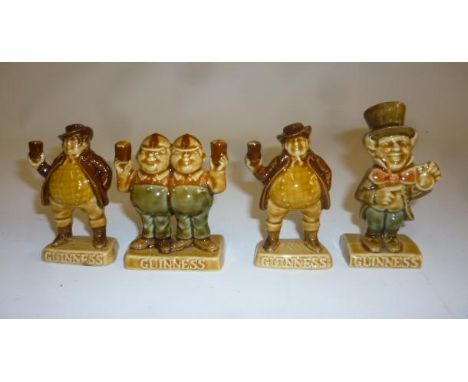Five Guinness Wade pottery miniatures comprising Tweedledum and Tweedledee, the Wellington Boot, the Mad Hatter and two Sam W