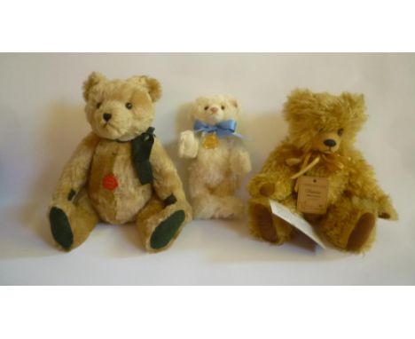 A Steiff "George Royal Baby Bear", in cream plush, 10" high, with box and certificate, a Hermann teddy bear in pale gold plus