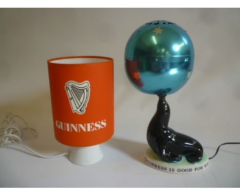 A Guinness Carltonware pottery seal table lamp, base AF, with blue aluminium revolving globe shade, 15" high overall, and ano