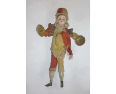 A Schoenau & Hoffmeister mechanical doll with bisque head, fixed blue glass eyes, painted wooden body and limbs, lever operat