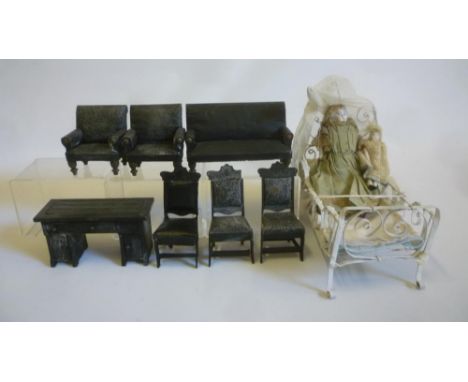 A large scale seven piece dolls house suite upholstered in leatherette including settee and two easy chairs, a metal single b