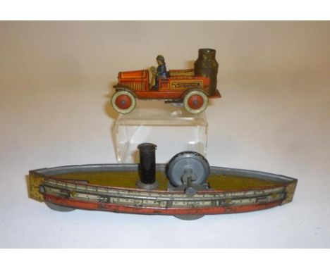 A Steamship, tinplate, c.1900, (possibly Hess), giro operated, hull printed with gunports, 9 1/2" long, and a Tipp & Co fire 