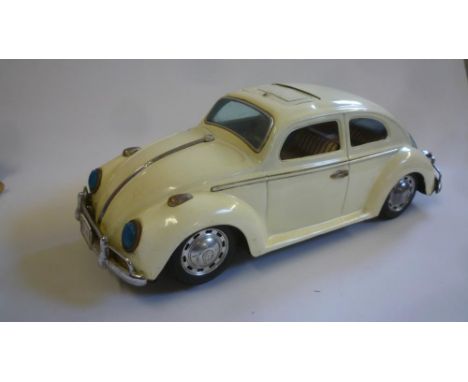 A Volkswagen Beetle, Japanese, battery powered motor, tinplate, sunshine roof, see-through cover to engine compartment, 14 1/