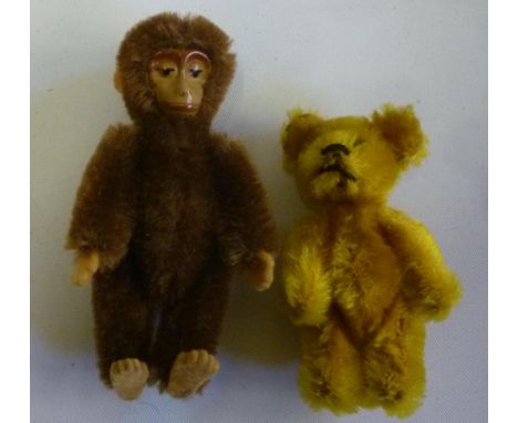 A Schuco miniature monkey and teddy bear, the brown plush metal faced monkey with swivel joints and felt claws, 3 1/2" high, 